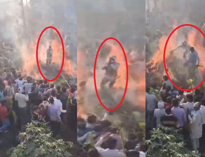 Sambhal: सम्भल में जलती होली पर चढ़ा शख्स, युवक ने खींचकर बचाई जान, वीडियो वायरल।